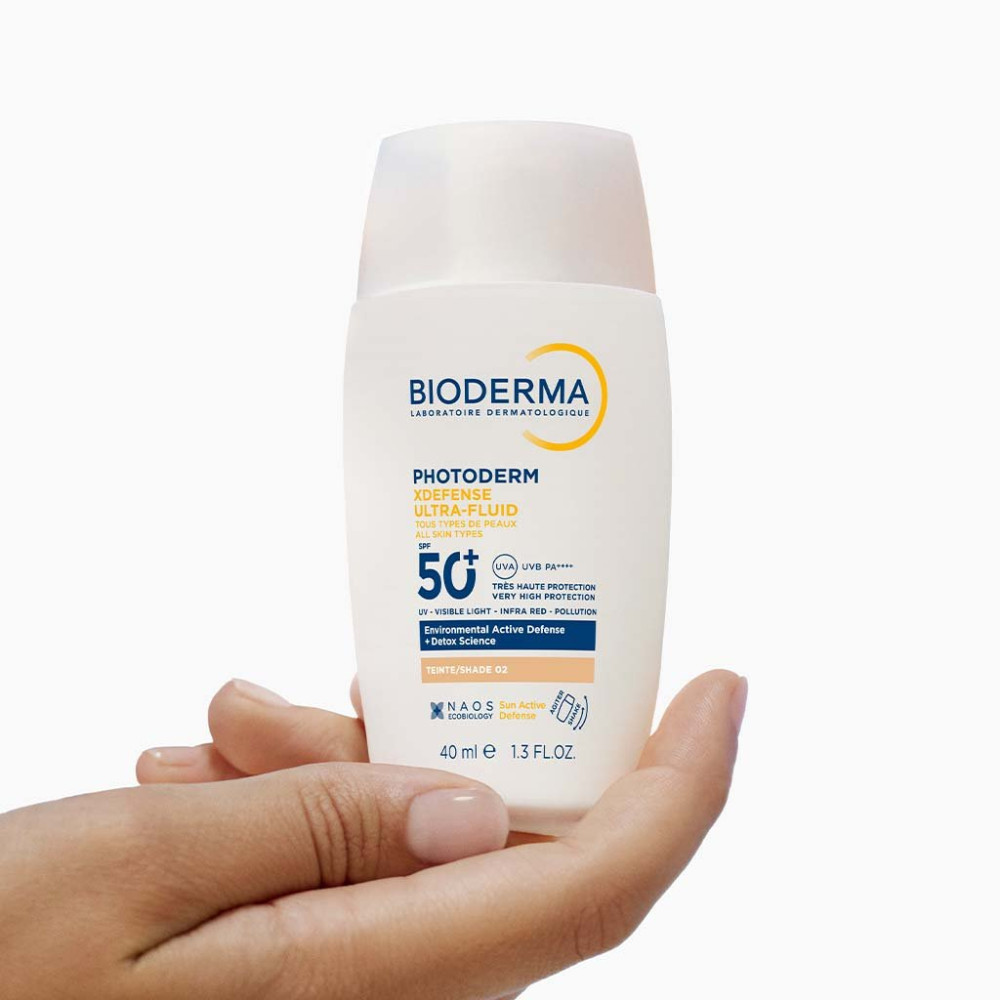 BIODERMA PHOTODERM XDEFENSE SPF50+ слънцезащитен тониран ултрафлуид за лице за всеки тип кожа Светъл цвят 40 мл - Слънцезащита